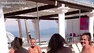 Public stripping game topless in Greece
