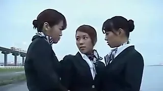 Three japanese airline stewardess kissing!