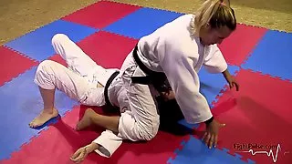 Girls wrestling in kimonos (pindown match)