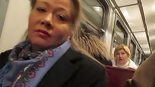 Girl flashing fishnet stockings in a train